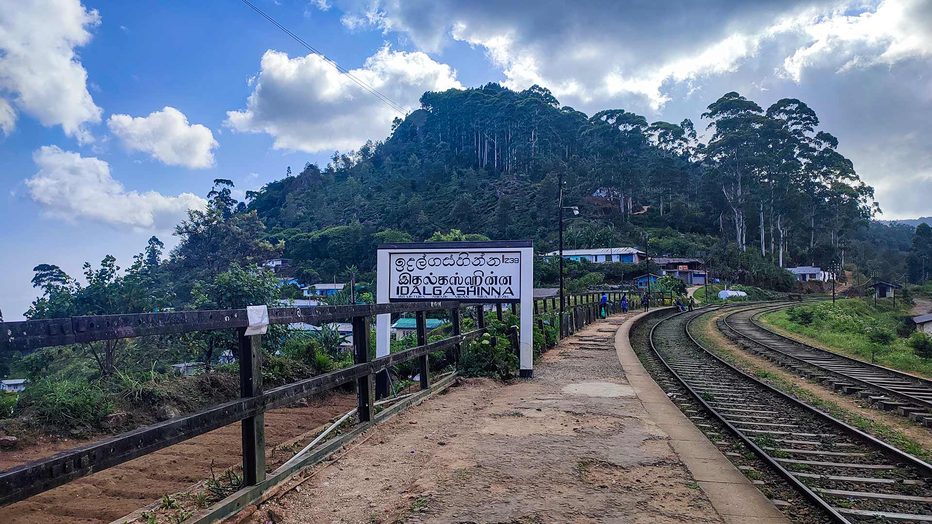 Idalgashinna Mountain ridge overlooking railway line and tea estates in Sri Lanka highlands